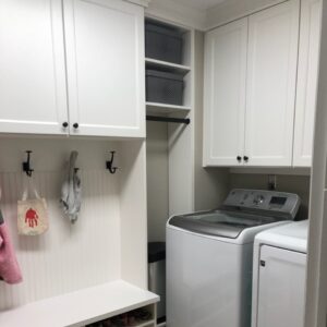 Multifunctional mudroom and laundry room with custom storage and dual-purpose design.