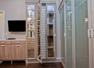 Custom walk in closet with glass panels