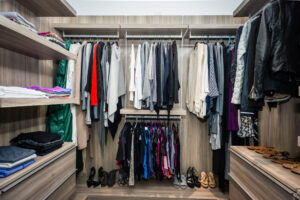 Modern reach in closet with shoe storage system