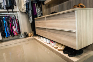 Custom reach in closet with built in shoe storage