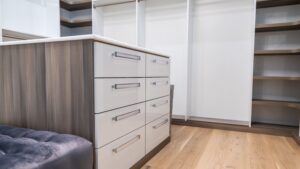 Modern walk in closet in light wood and white texture