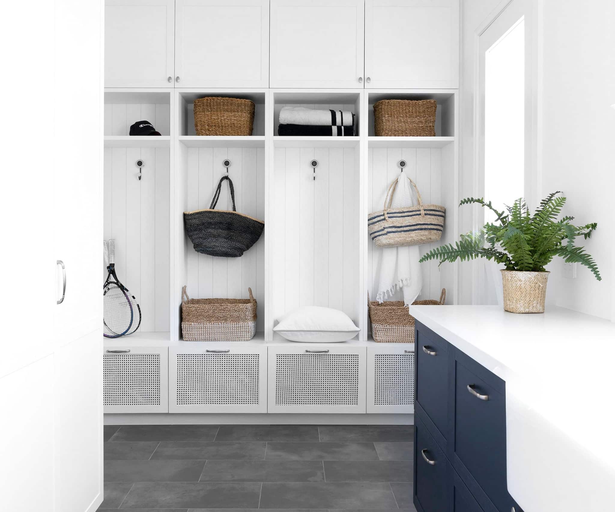 Modern mudroom with custom cabinets and storage solutions, offering a clean and organized entryway.