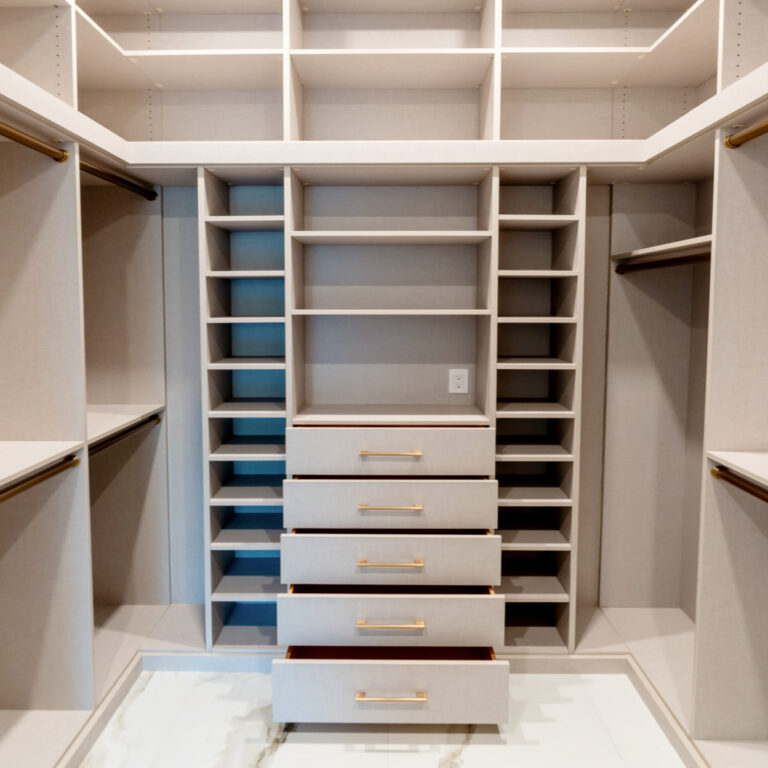 Luxury Walk-In Closet With Custom Drawers, Adjustable Shelving, And Spacious Hanging Sections.