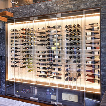 Modern wine storage with custom wine racks and LED lighting, designed for optimal display and preservation of wine collections.